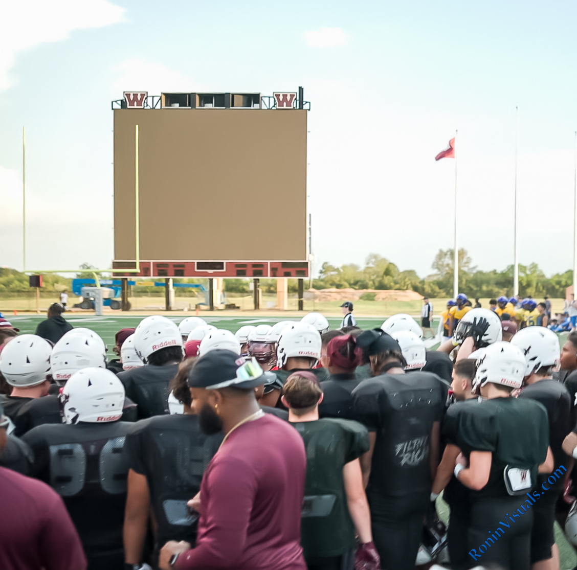 The Waller Bulldogs rally at Daikin Stadium with the new scoreboard behind them. (RoninVisuals.com photo by Alberto Mata Jr.)