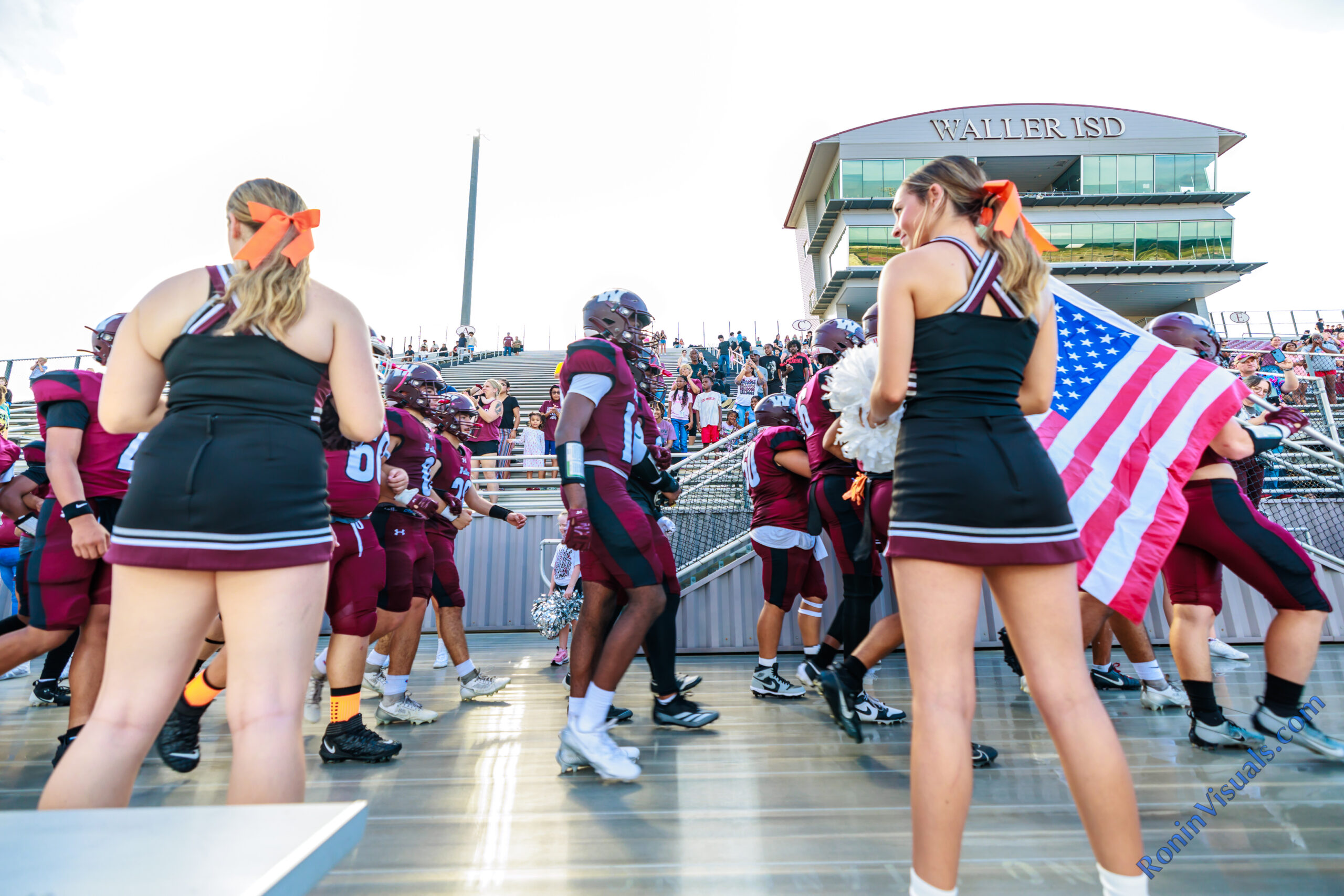 The Waller Bulldog football team takes to the field en route to defeating Conroe Caney Creek, 41-7, for the Bulldog’s first victory at home since 2021, at Daikin Stadium, Aug. 31, 2024. (Photo by Creighton Holub, courtesy RoninVisuals.com)