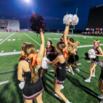 The Waller Bulldog cheerleaders explode as the football team takes a commanding lead in the eventual victory over Conroe Caney Creek, 41-7, for the Bulldog’s first victory at home since 2021, at Daikin Stadium, Aug. 31, 2024. (Photo by Creighton Holub, courtesy RoninVisuals.com)