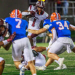 Brandon Stewart (1) breaks a tackle while his teammates do everything they can to buy him more real estate. The Waller Bulldog football team slips against Conroe Grand Oaks, 17-14, for the Bulldog’s first loss of the 2024 campaign, at Moorehead Stadium in Conroe, Sept. 5, 2024. (Photo by Creighton Holub, courtesy RoninVisuals.com)