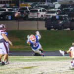 Senior kicker Joevan Ortiz (13) scores the extra point with the help of Ethan Breeden (16). The Waller Bulldog football team slips against Conroe Grand Oaks, 17-14, for the Bulldog’s first loss of the 2024 campaign, at Moorehead Stadium in Conroe, Sept. 5, 2024. (Photo by Creighton Holub, courtesy RoninVisuals.com)